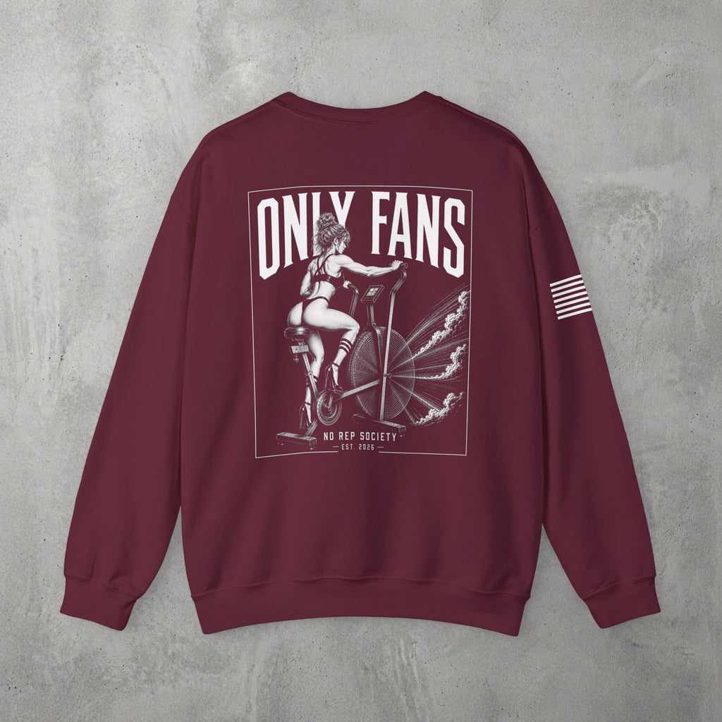 Maroon Only Fans Crewneck by The No Rep Society, flat lay on grey concrete, back print of a pin-up figure seated on a large industrial fan inside a bordered frame under ONLY FANS lettering, with striped sleeve detail.