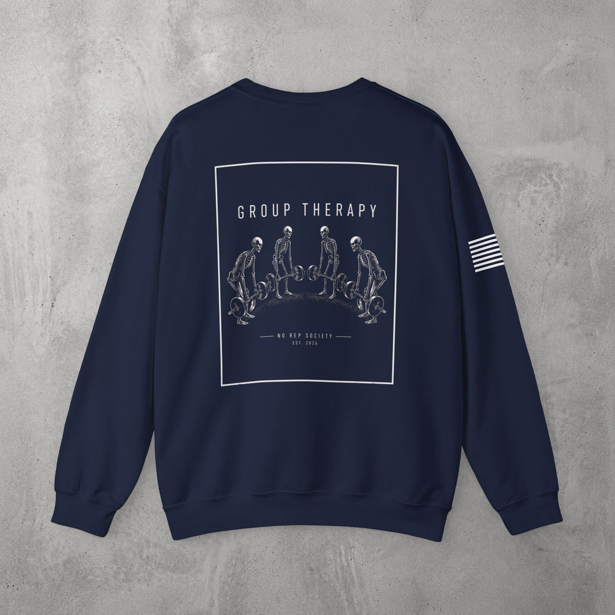 Navy Group Therapy Crewneck by The No Rep Society, flat lay on grey concrete, back print of a circle of exhausted figures collapsed on the floor under GROUP THERAPY lettering.