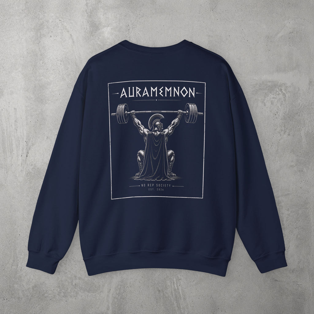 Navy Auramemnon Crewneck by The No Rep Society, flat lay on grey concrete, back print of a caped warrior in a plumed helmet pressing a loaded barbell overhead under AURAMEMNON lettering.