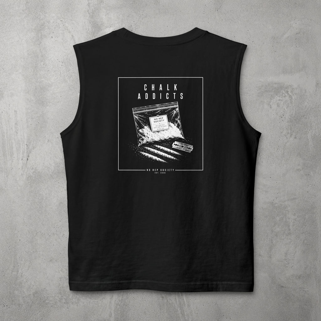 Black Chalk Addicts Muscle Tank by The No Rep Society, flat lay on grey concrete, back print of an open bag of gym chalk spilling across a bordered frame under CHALK ADDICTS lettering.
