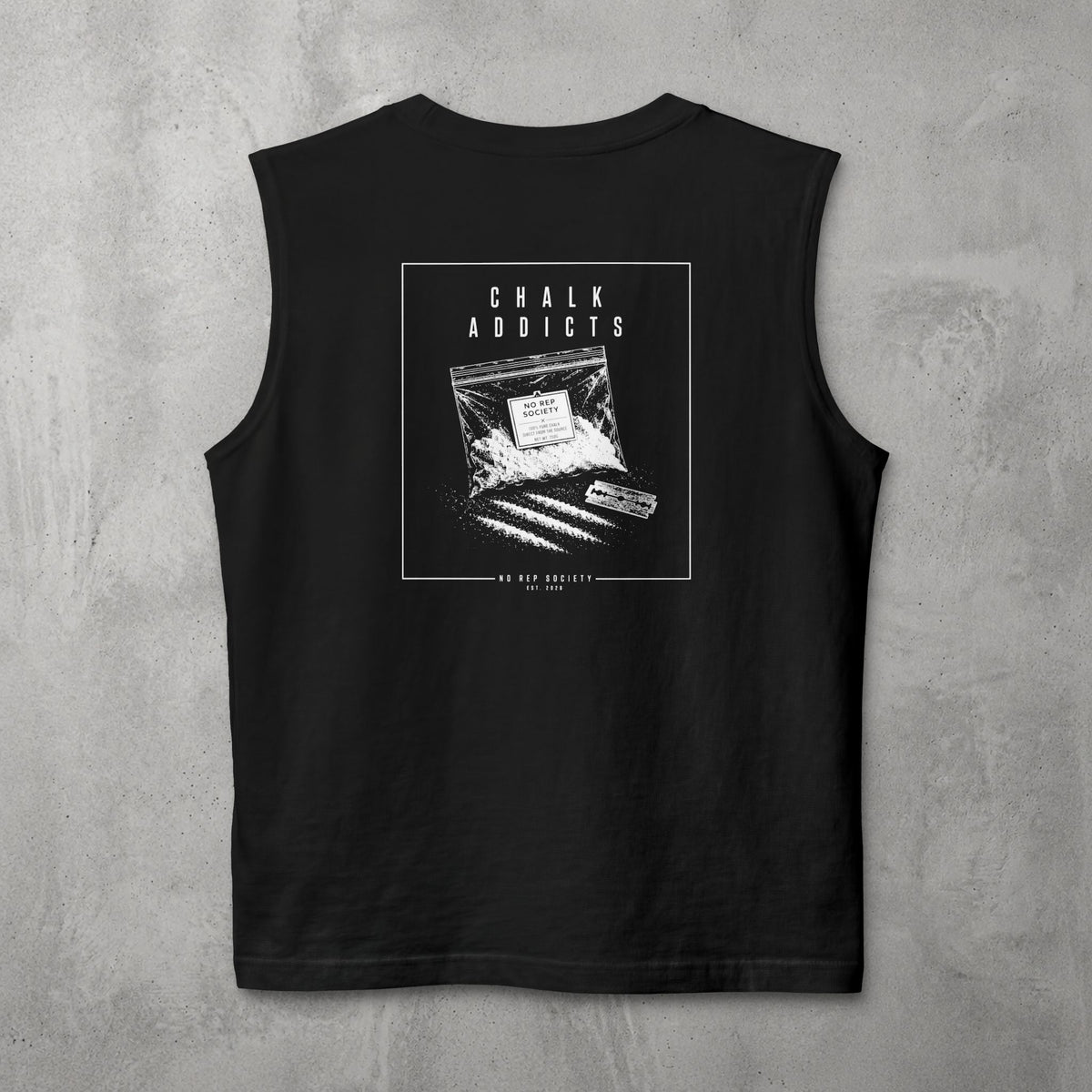 Black Chalk Addicts Muscle Tank by The No Rep Society, flat lay on grey concrete, back print of an open bag of gym chalk spilling across a bordered frame under CHALK ADDICTS lettering.
