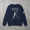 Navy Size Matters Crewneck by The No Rep Society, flat lay on grey concrete, back print of a hand gripping a large weight plate under SIZE MATTERS lettering.