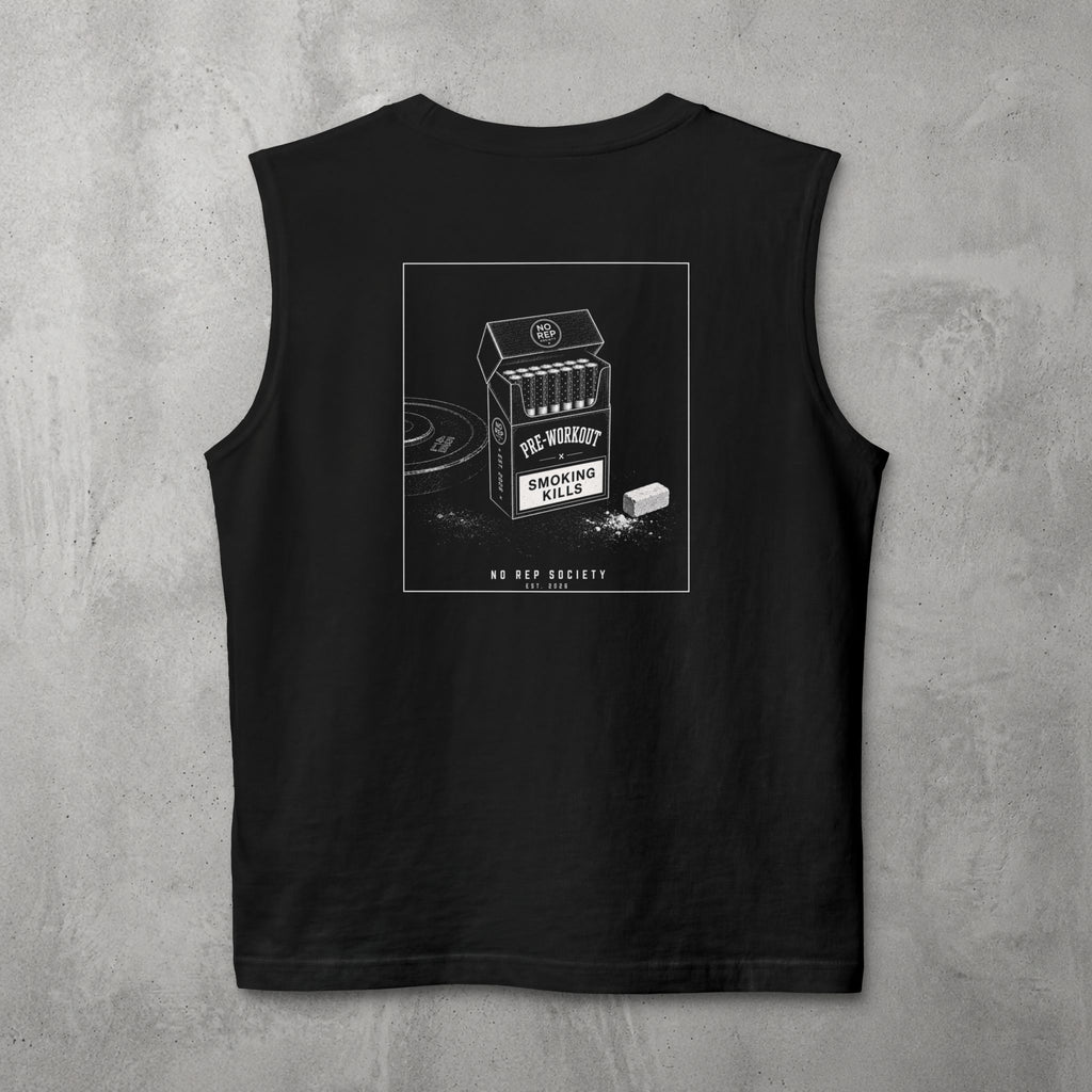 Black Pre-Workout Muscle Tank by The No Rep Society, flat lay on grey concrete, back print of an open cigarette pack labelled PRE-WORKOUT with a SMOKING KILLS warning and a scoop spilling powder.