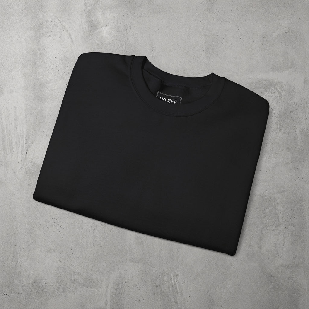 Black AMNRAP Crewneck by The No Rep Society, folded flat on grey concrete.