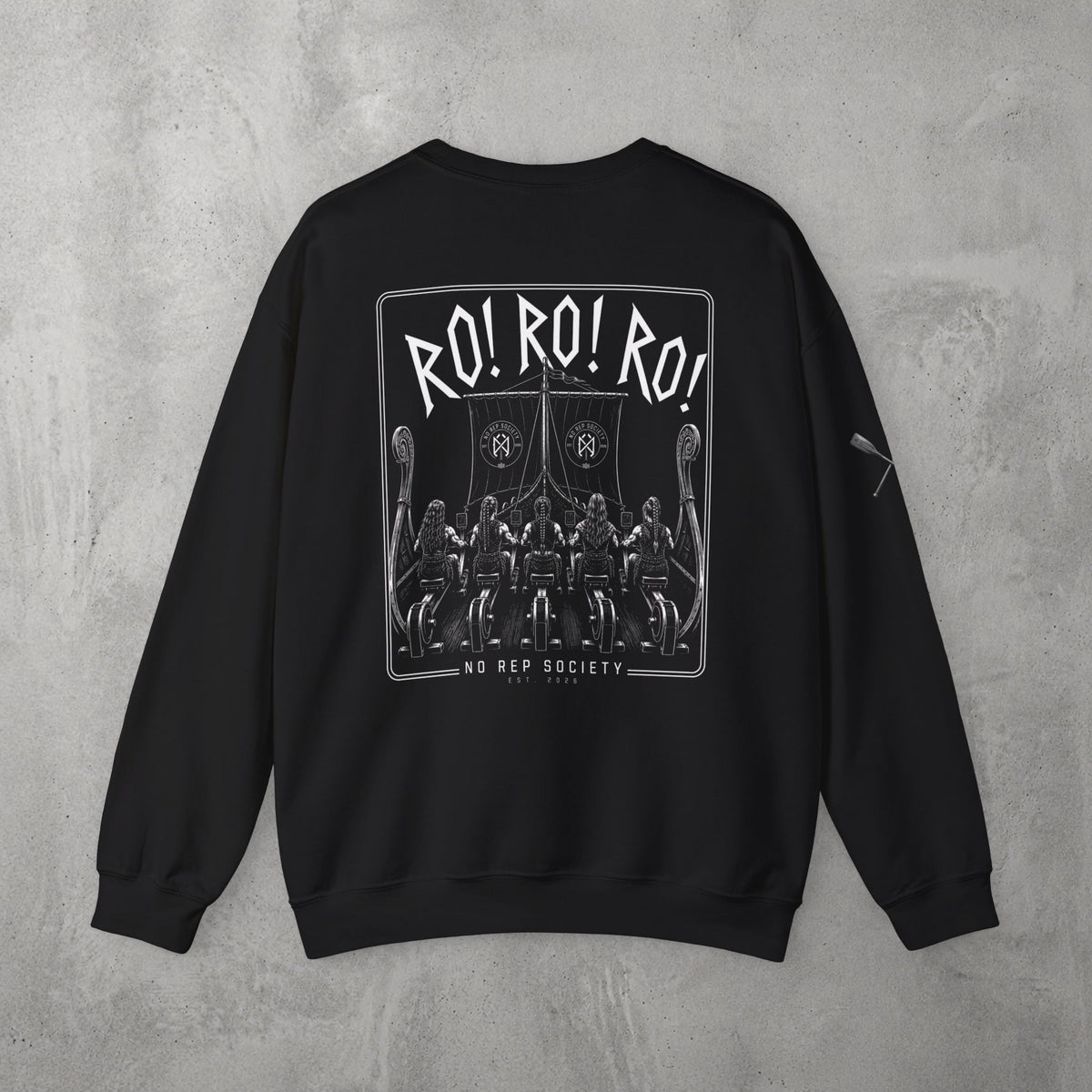 Black RO! RO! RO! Viking (WOMEN) Crewneck by The No Rep Society, flat lay on grey concrete, back print of a Viking longship with rows of oarsmen under sail beneath RO! RO! RO! lettering.
