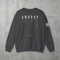 Dark Heather AMNRAP Crewneck by The No Rep Society, flat lay on grey concrete, back print of AMNRAP in wide spaced capitals with AS MANY NO-REPS AS POSSIBLE set vertically between the letters.