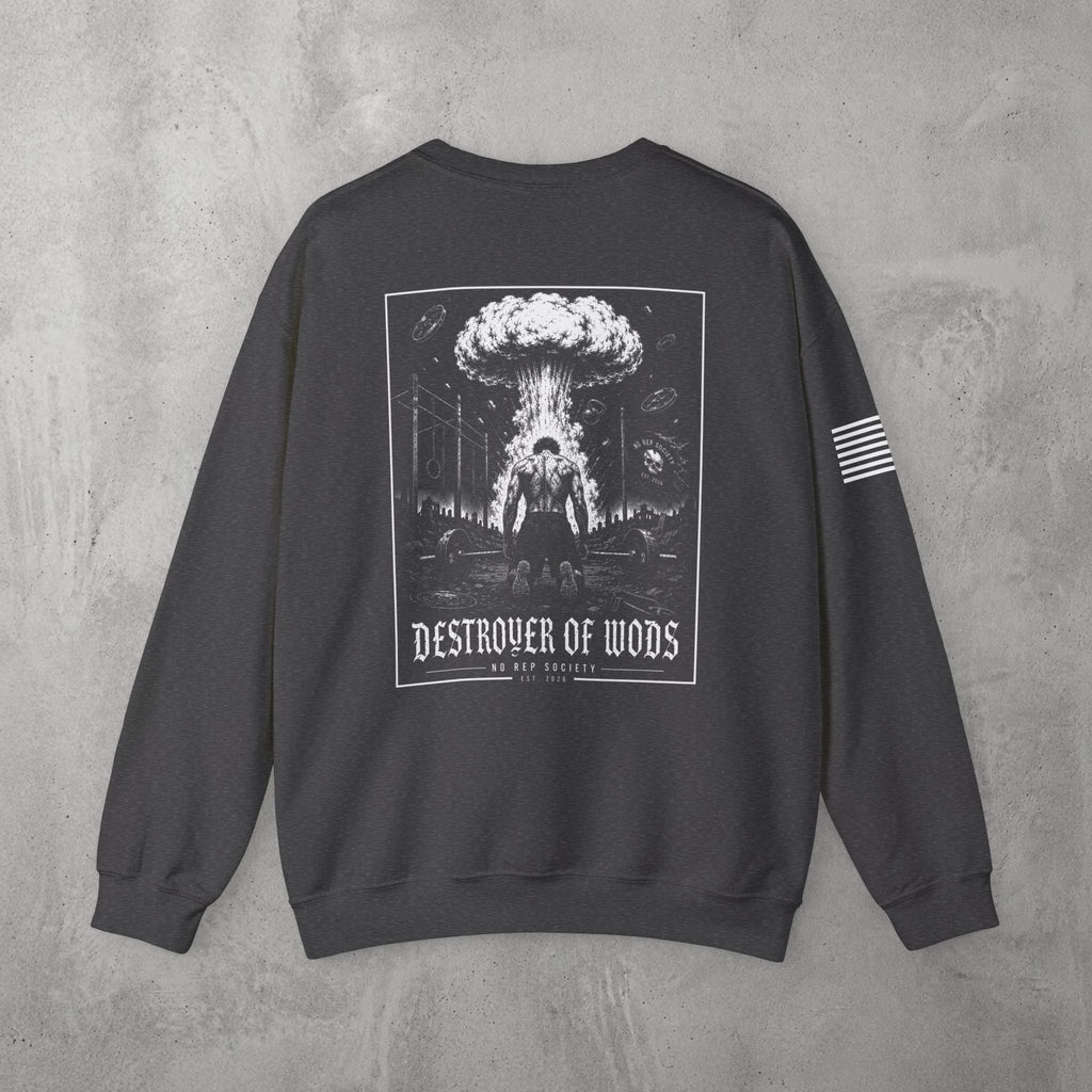 Dark Heather Destroyer of WODs (MEN) Crewneck by The No Rep Society, flat lay on grey concrete, back print of a mushroom cloud rising over a lone figure under a DESTROYER OF WODS banner.