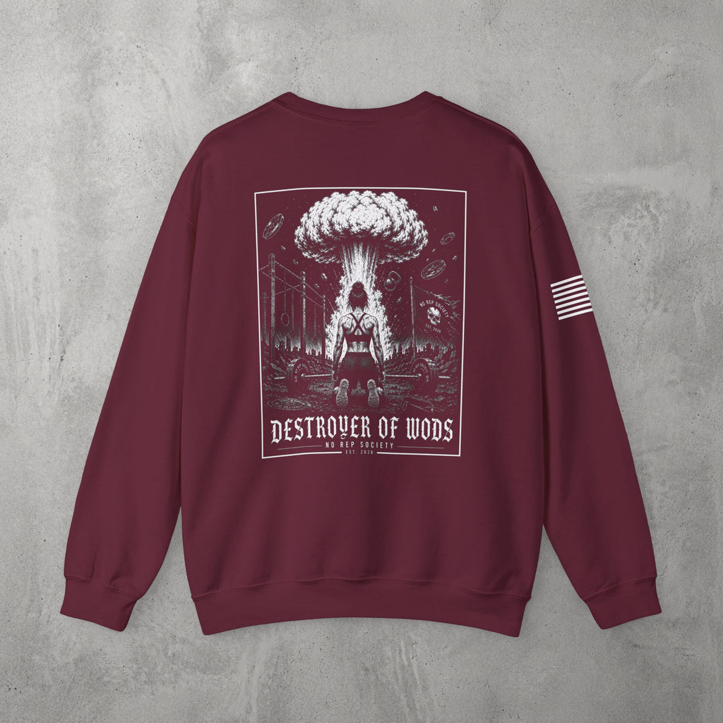 Maroon Destroyer of WODs (WOMEN) Crewneck by The No Rep Society, flat lay on grey concrete, back print of a mushroom cloud rising over a lone figure under a DESTROYER OF WODS banner.