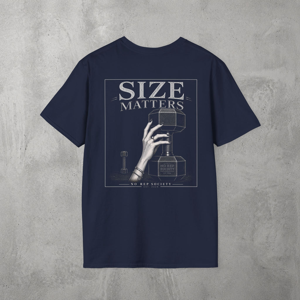 Navy Size Matters Tee by The No Rep Society, flat lay on grey concrete, back print of a hand gripping a large weight plate under SIZE MATTERS lettering.