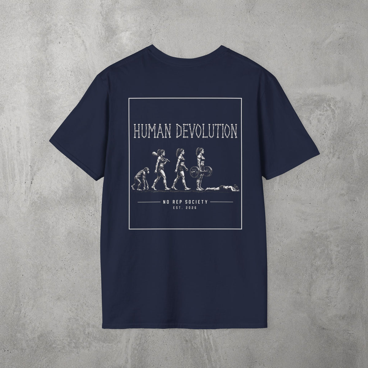 Navy Human Devolution (WOMEN) Tee by The No Rep Society, flat lay on grey concrete, back print of evolution silhouettes ending face-down on the floor under HUMAN DEVOLUTION lettering.