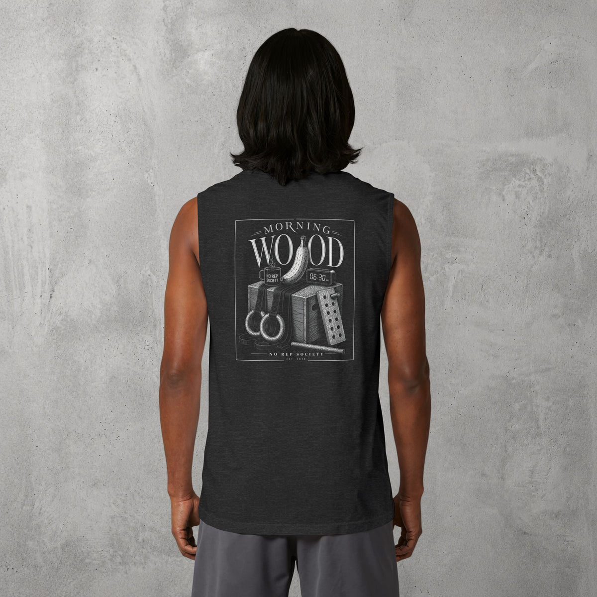 Dark Grey Heather Morning Wood Muscle Tank worn by a female model, back view showing the Morning Wood print.
