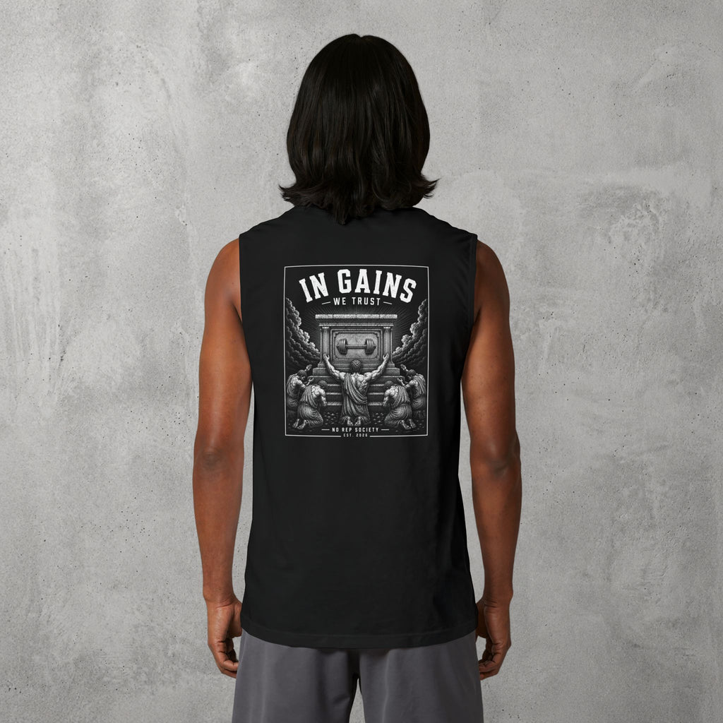 Black In Gains We Trust Muscle Tank worn by a female model, back view showing the In Gains We Trust print.
