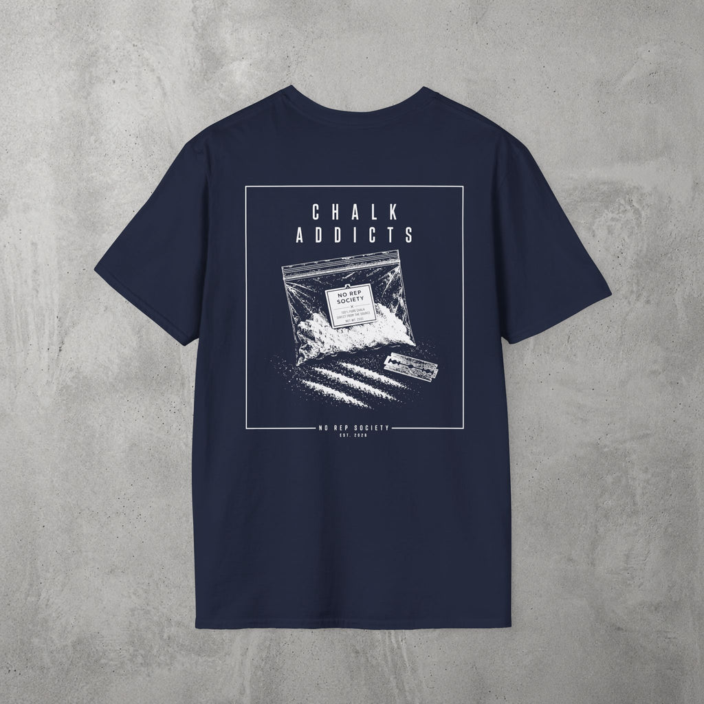 Navy Chalk Addicts Tee by The No Rep Society, flat lay on grey concrete, back print of an open bag of gym chalk spilling across a bordered frame under CHALK ADDICTS lettering.
