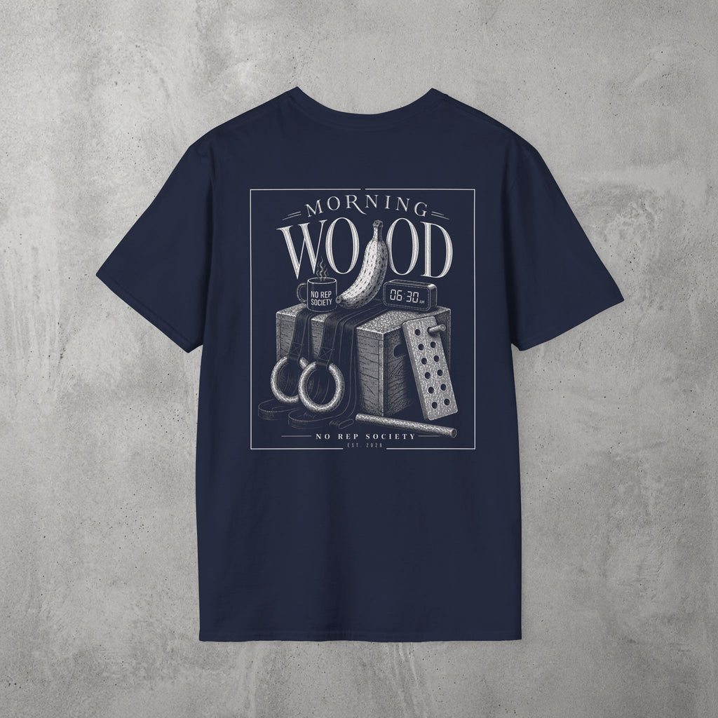 Navy Morning Wood Tee by The No Rep Society, flat lay on grey concrete, back print of a banana, gymnastic rings and a wooden plyo box under MORNING WOOD lettering.