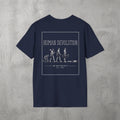 Navy Human Devolution (MEN) Tee by The No Rep Society, flat lay on grey concrete, back print of evolution-of-man silhouettes ending face-down on the floor under HUMAN DEVOLUTION lettering.