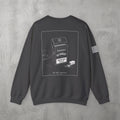 Dark Heather Pre-Workout Crewneck by The No Rep Society, flat lay on grey concrete, back print of an open cigarette pack labelled PRE-WORKOUT with a SMOKING KILLS warning and a scoop spilling powder.