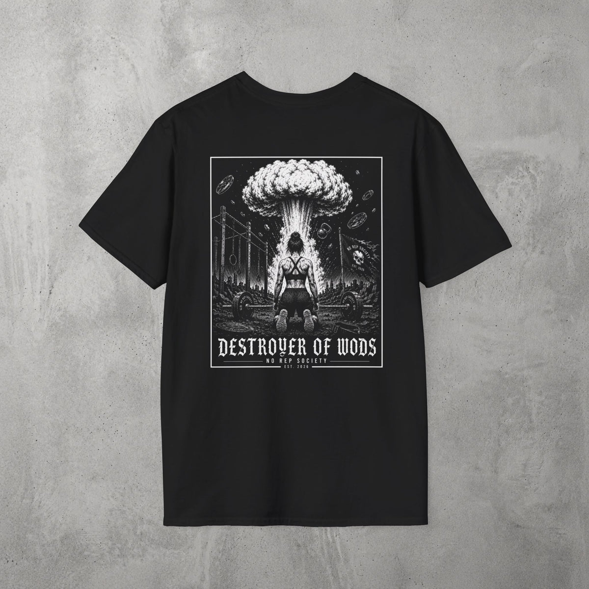 Black Destroyer of WODs (WOMEN) Tee by The No Rep Society, flat lay on grey concrete, back print of a mushroom cloud rising over a lone figure under a DESTROYER OF WODS banner.