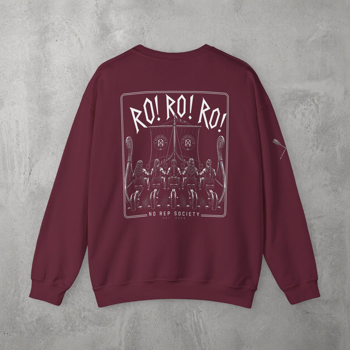 Maroon RO! RO! RO! Viking (WOMEN) Crewneck by The No Rep Society, flat lay on grey concrete, back print of a Viking longship with rows of oarsmen under sail beneath RO! RO! RO! lettering.