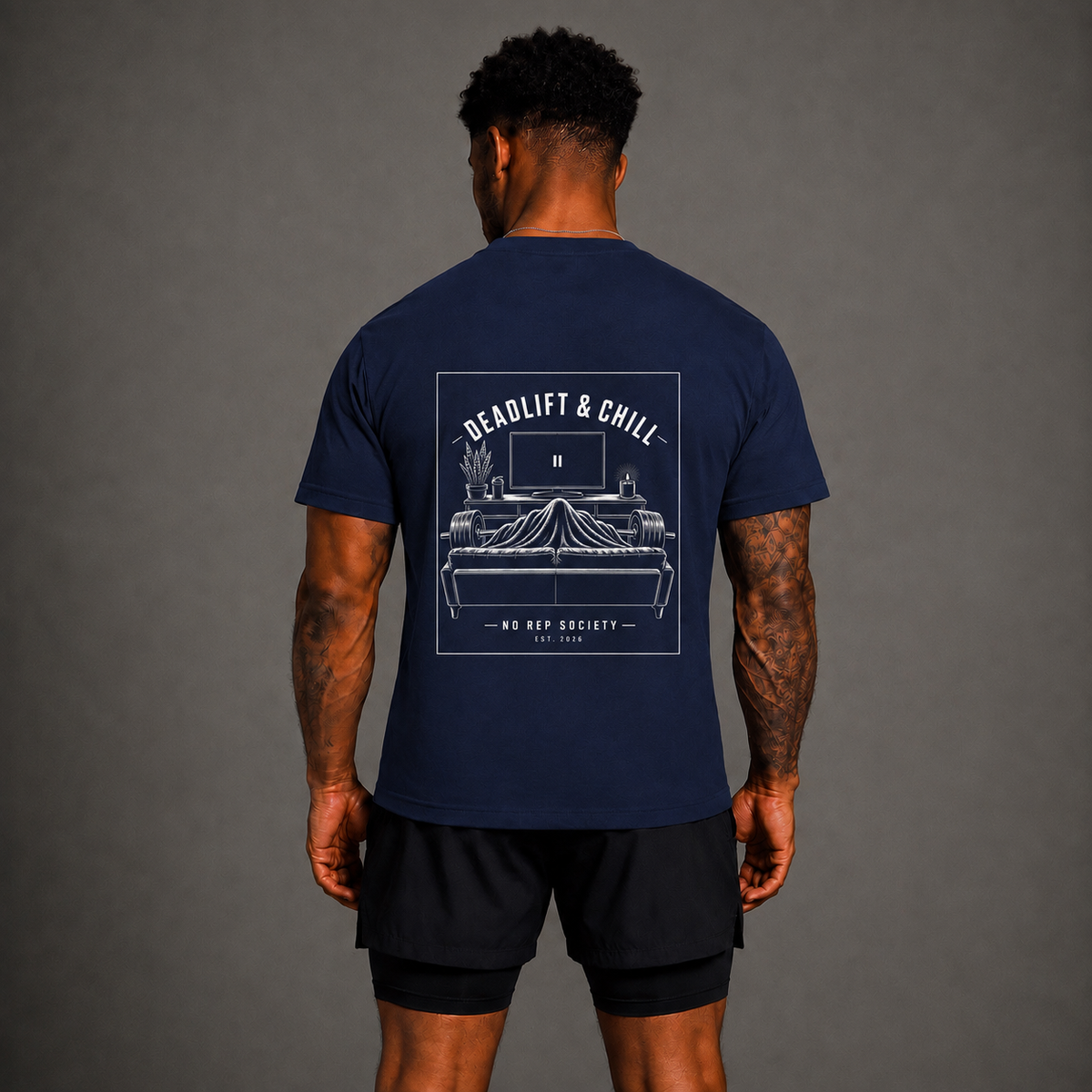 Navy Deadlift & Chill Tee by The No Rep Society, worn by a male model, back view showing the DEADLIFT & CHILL print.