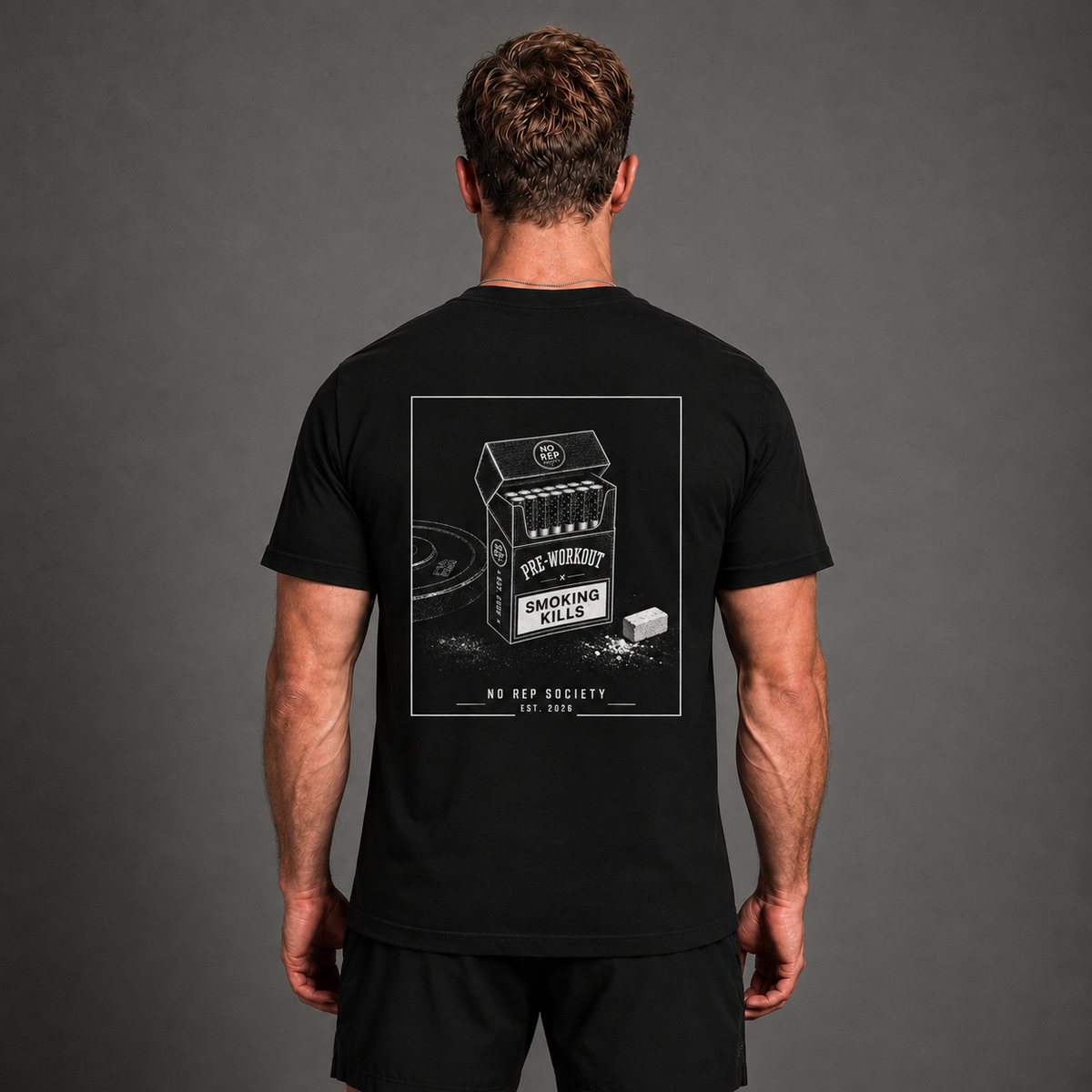 Black Pre-Workout Tee by The No Rep Society, worn by a male model, back view showing the PRE-WORKOUT print.