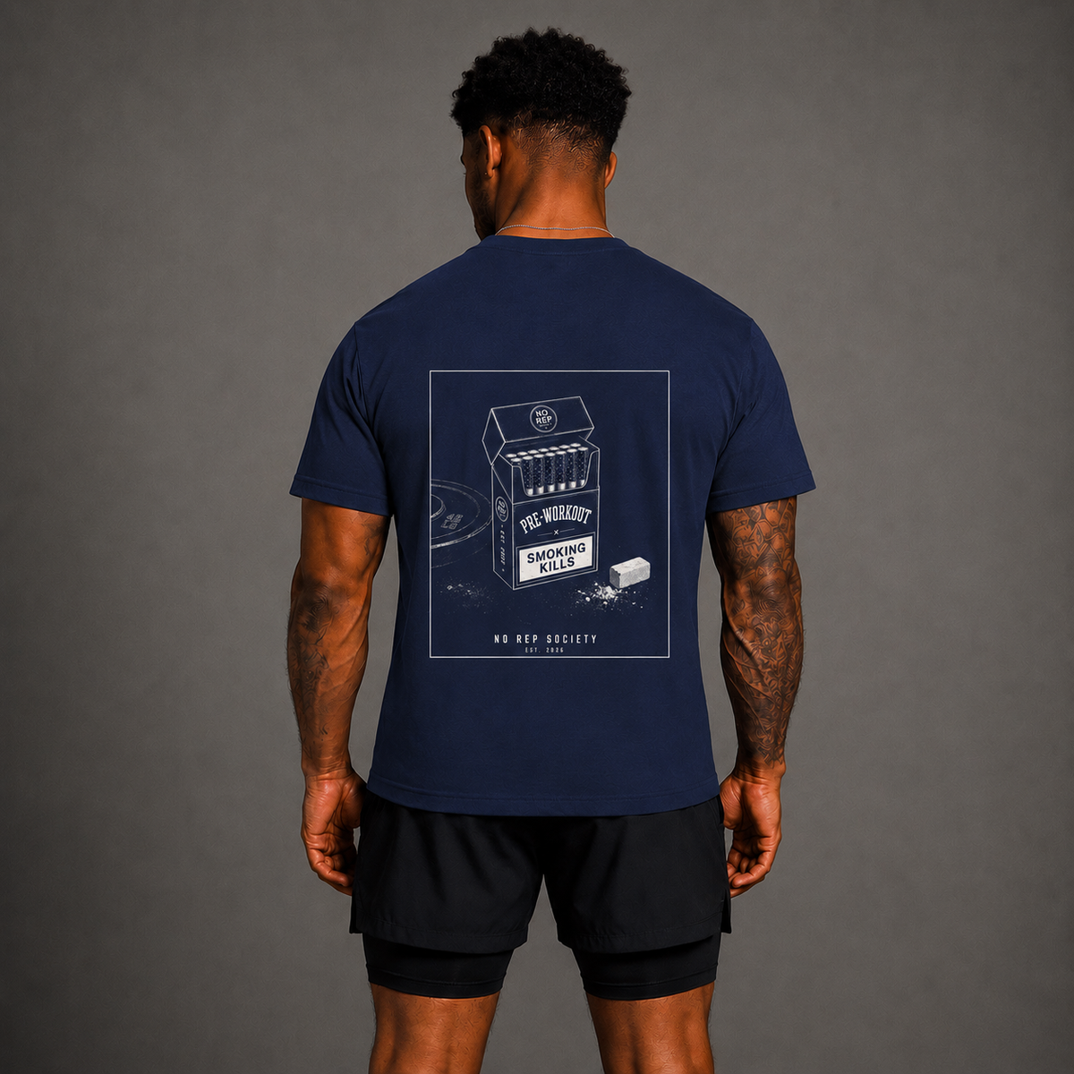 Navy Pre-Workout Tee by The No Rep Society, worn by a male model, back view showing the PRE-WORKOUT print.