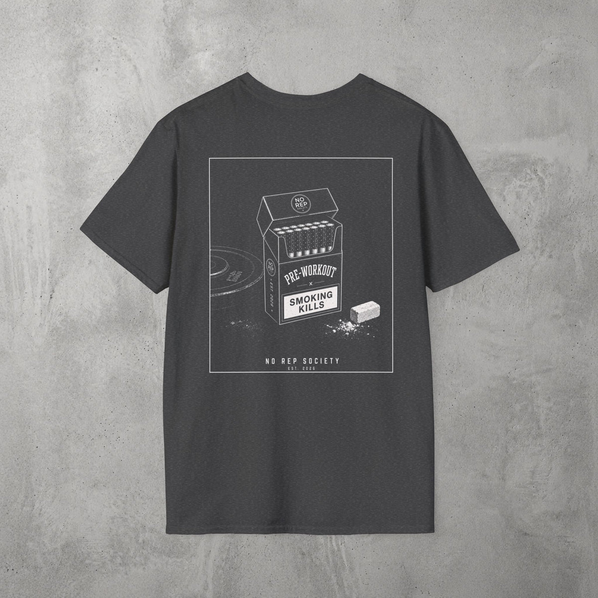 Dark Heather Pre-Workout Tee by The No Rep Society, flat lay on grey concrete, back print of an open cigarette pack labelled PRE-WORKOUT with a SMOKING KILLS warning and a scoop spilling powder.