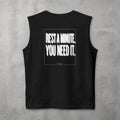 Black Rest A Minute Muscle Tank by The No Rep Society, flat lay on grey concrete, back print of REST A MINUTE. YOU NEED IT. in bold blurred capitals inside a thin frame.