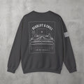 Dark Heather Deadlift & Chill Crewneck by The No Rep Society, flat lay on grey concrete, back print of a bed and television drawn in fine line art under DEADLIFT & CHILL lettering.