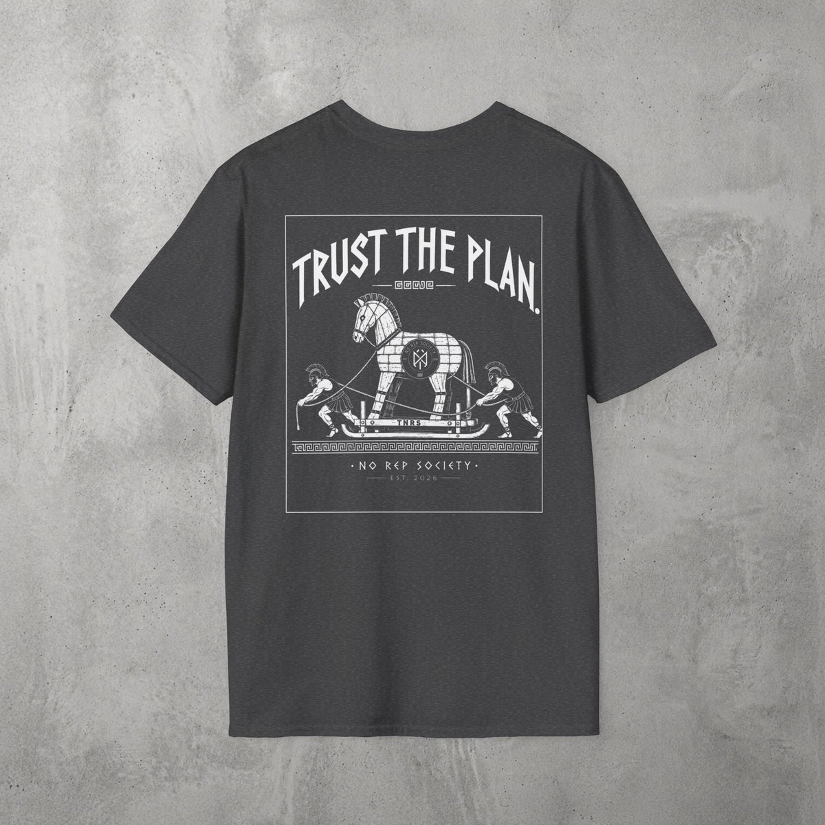 Dark Heather Trust The Plan Tee by The No Rep Society, flat lay on grey concrete, back print of the Trojan Horse with figures around it under TRUST THE PLAN lettering.