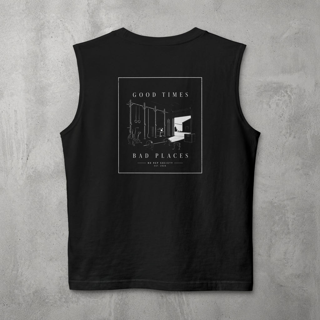 Black Good Times, Bad Places Muscle Tank by The No Rep Society, flat lay on grey concrete, back print of a rowing machine in fine line art between GOOD TIMES and BAD PLACES lettering.