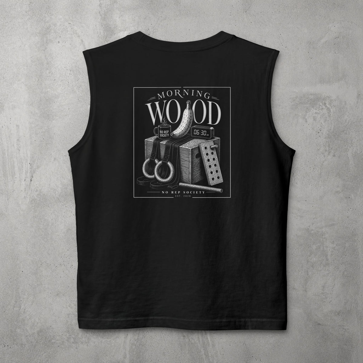 Black Morning Wood Muscle Tank by The No Rep Society, flat lay on grey concrete, back print of a banana, gymnastic rings and a wooden plyo box under MORNING WOOD lettering.