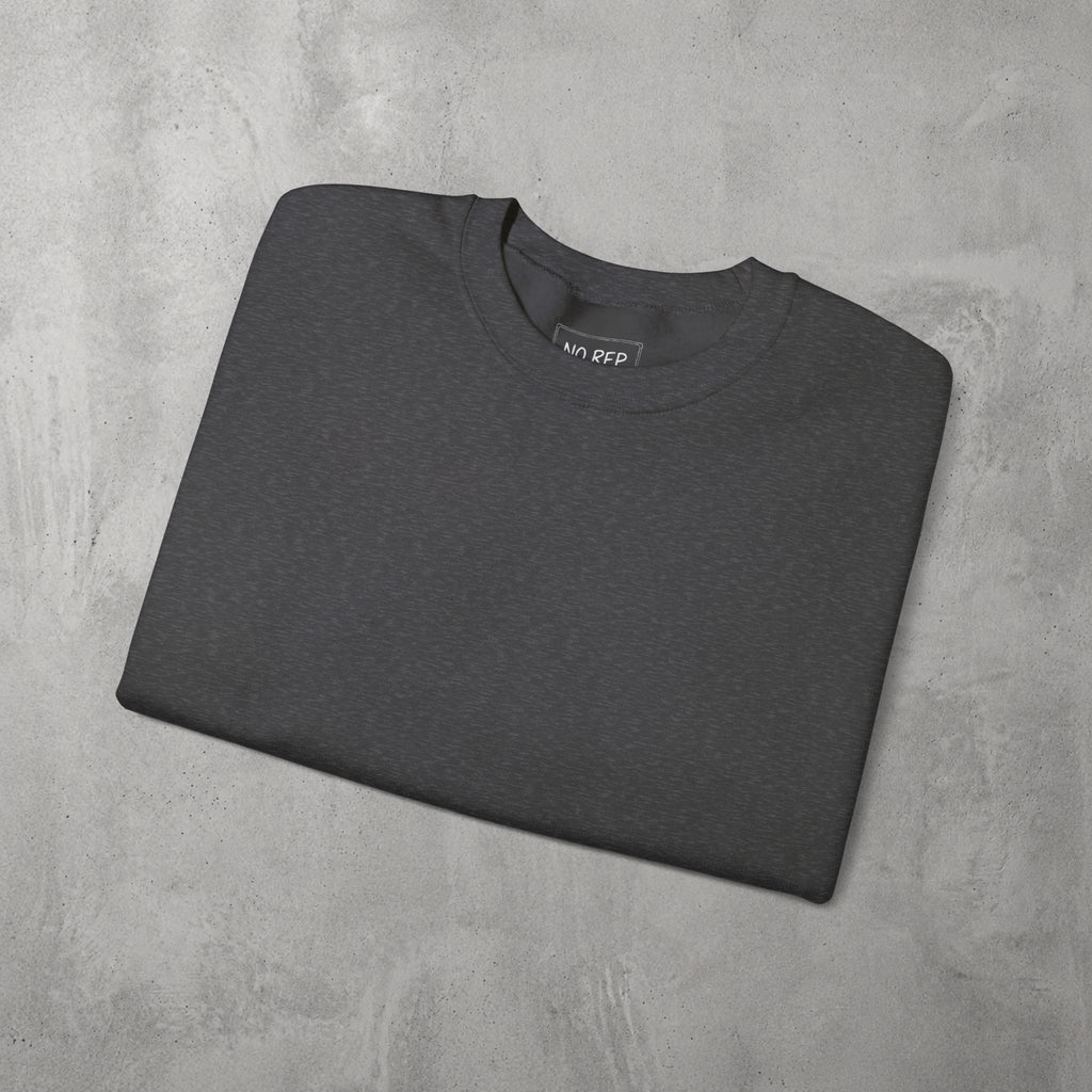 Dark Heather AMNRAP Crewneck by The No Rep Society, folded flat on grey concrete.