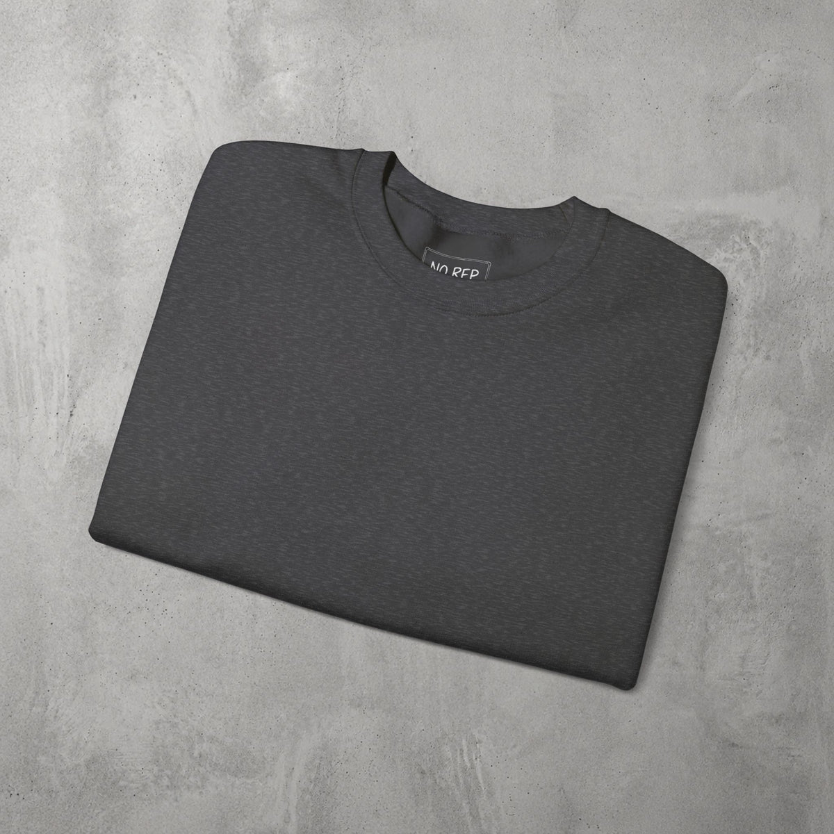 Dark Heather AMNRAP Crewneck by The No Rep Society, folded flat on grey concrete.