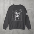 Dark Heather I Know You're Watching Crewneck by The No Rep Society, flat lay on grey concrete, back print of a woman mid back-squat inside a bordered frame under I KNOW YOU'RE WATCHING lettering.