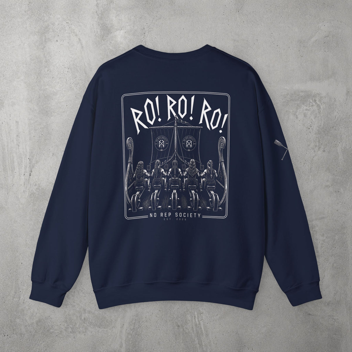 Navy RO! RO! RO! Viking (WOMEN) Crewneck by The No Rep Society, flat lay on grey concrete, back print of a Viking longship with rows of oarsmen under sail beneath RO! RO! RO! lettering.