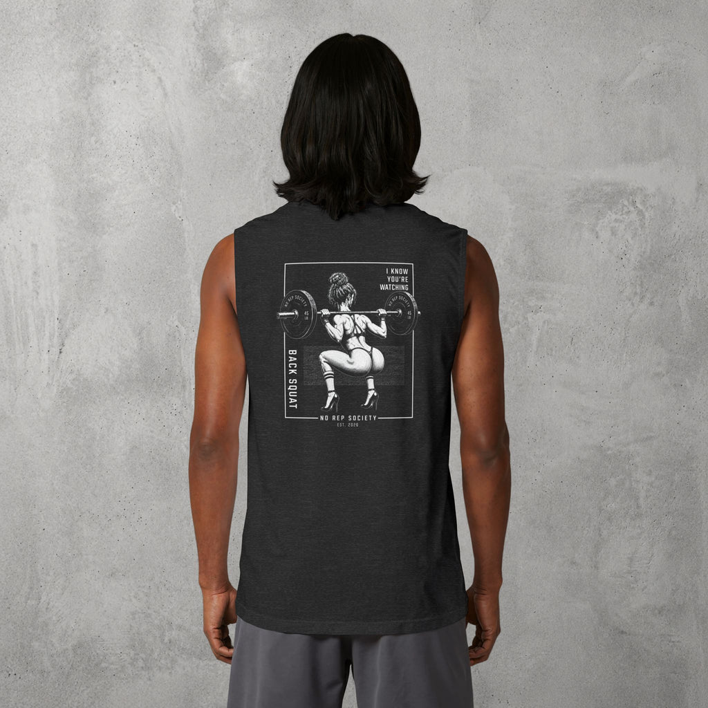 Dark Grey Heather I Know You're Watching Muscle Tank worn by a female model, back view showing the I Know You're Watching print.