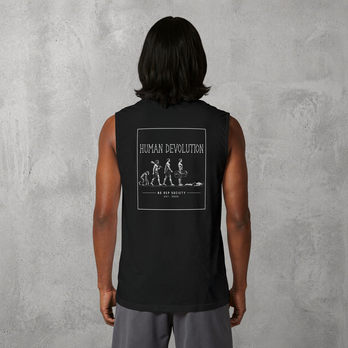 Black Human Devolution (MEN) Muscle Tank worn by a female model, back view showing the Human Devolution print.