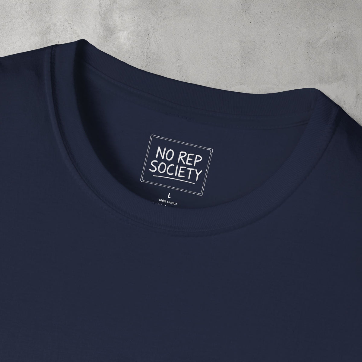 Close-up of the inner neck label of the Navy AMNRAP Tee reading NO REP SOCIETY.