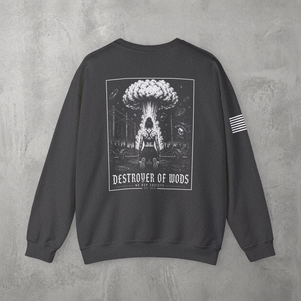 Dark Heather Destroyer of WODs (WOMEN) Crewneck by The No Rep Society, flat lay on grey concrete, back print of a mushroom cloud rising over a lone figure under a DESTROYER OF WODS banner.