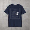 Navy Good Times, Bad Places Tee by The No Rep Society, flat lay on grey concrete, back print of a rowing machine in fine line art between GOOD TIMES and BAD PLACES lettering.
