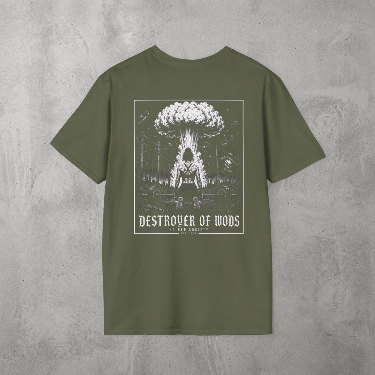 Military Green Destroyer of WODs (WOMEN) Tee by The No Rep Society, flat lay on grey concrete, back print of a mushroom cloud rising over a lone figure under a DESTROYER OF WODS banner.
