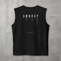 Black AMNRAP Muscle Tank by The No Rep Society, flat lay on grey concrete, back print of AMNRAP in wide spaced capitals with AS MANY NO-REPS AS POSSIBLE set vertically between the letters.
