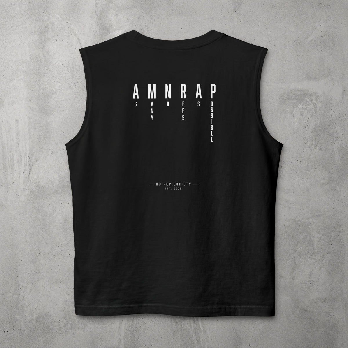 Black AMNRAP Muscle Tank by The No Rep Society, flat lay on grey concrete, back print of AMNRAP in wide spaced capitals with AS MANY NO-REPS AS POSSIBLE set vertically between the letters.