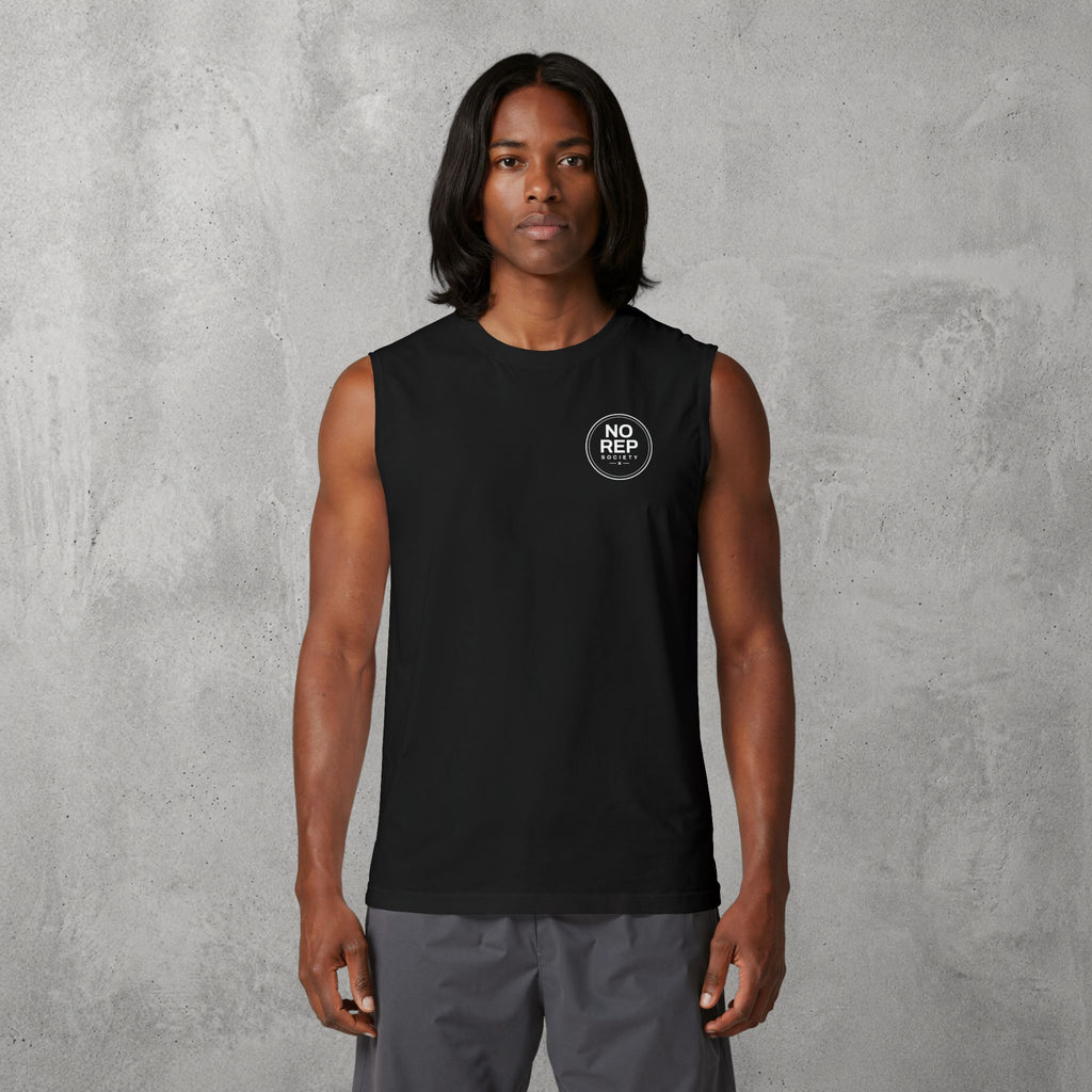Model wearing the Black NRS Clean Muscle Tank by The No Rep Society, minimal circular NO REP SOCIETY chest logo and no back print.
