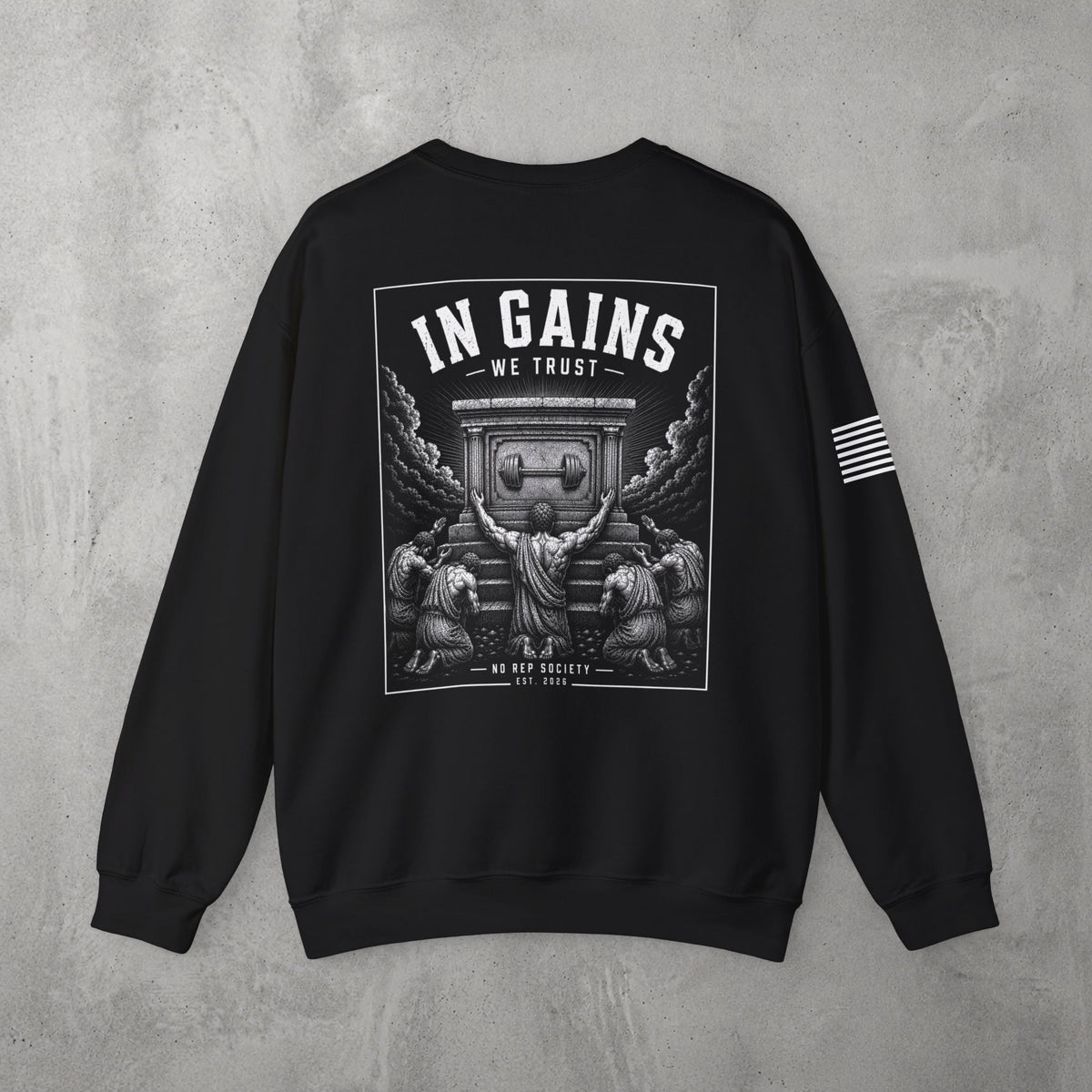 Black In Gains We Trust Crewneck by The No Rep Society, flat lay on grey concrete, back print of an ornate temple facade with two kneeling figures and laurel branches under IN GAINS WE TRUST lettering.