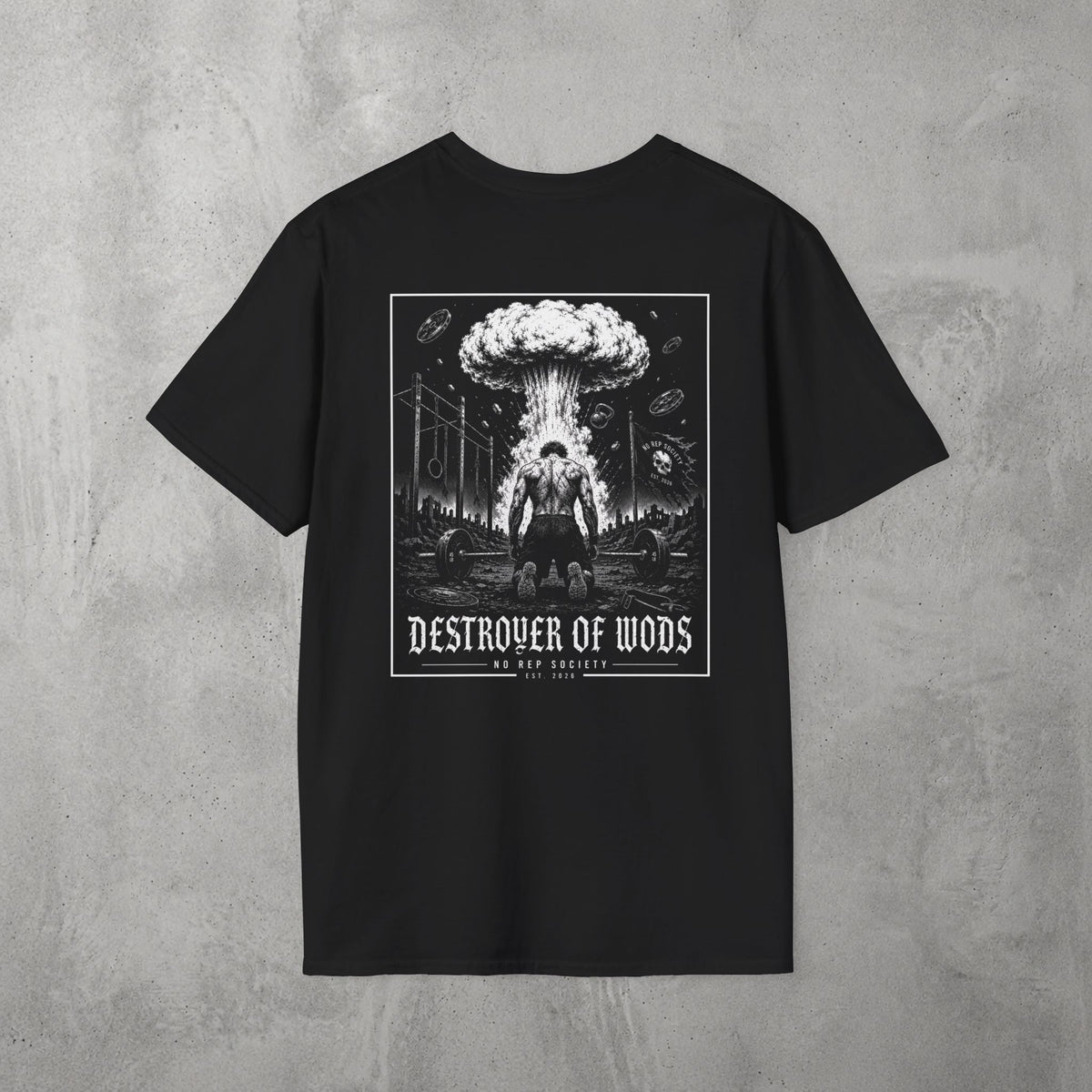 Black Destroyer of WODs (MEN) Tee by The No Rep Society, flat lay on grey concrete, back print of a mushroom cloud rising over a lone figure under a DESTROYER OF WODS banner.