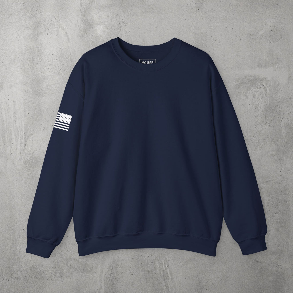 Navy AMNRAP Crewneck by The No Rep Society, plain front view with no print, flat lay on grey concrete.