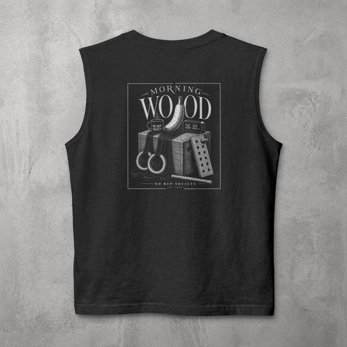 Dark Grey Heather Morning Wood Muscle Tank by The No Rep Society, flat lay on grey concrete, back print of a banana, gymnastic rings and a wooden plyo box under MORNING WOOD lettering.