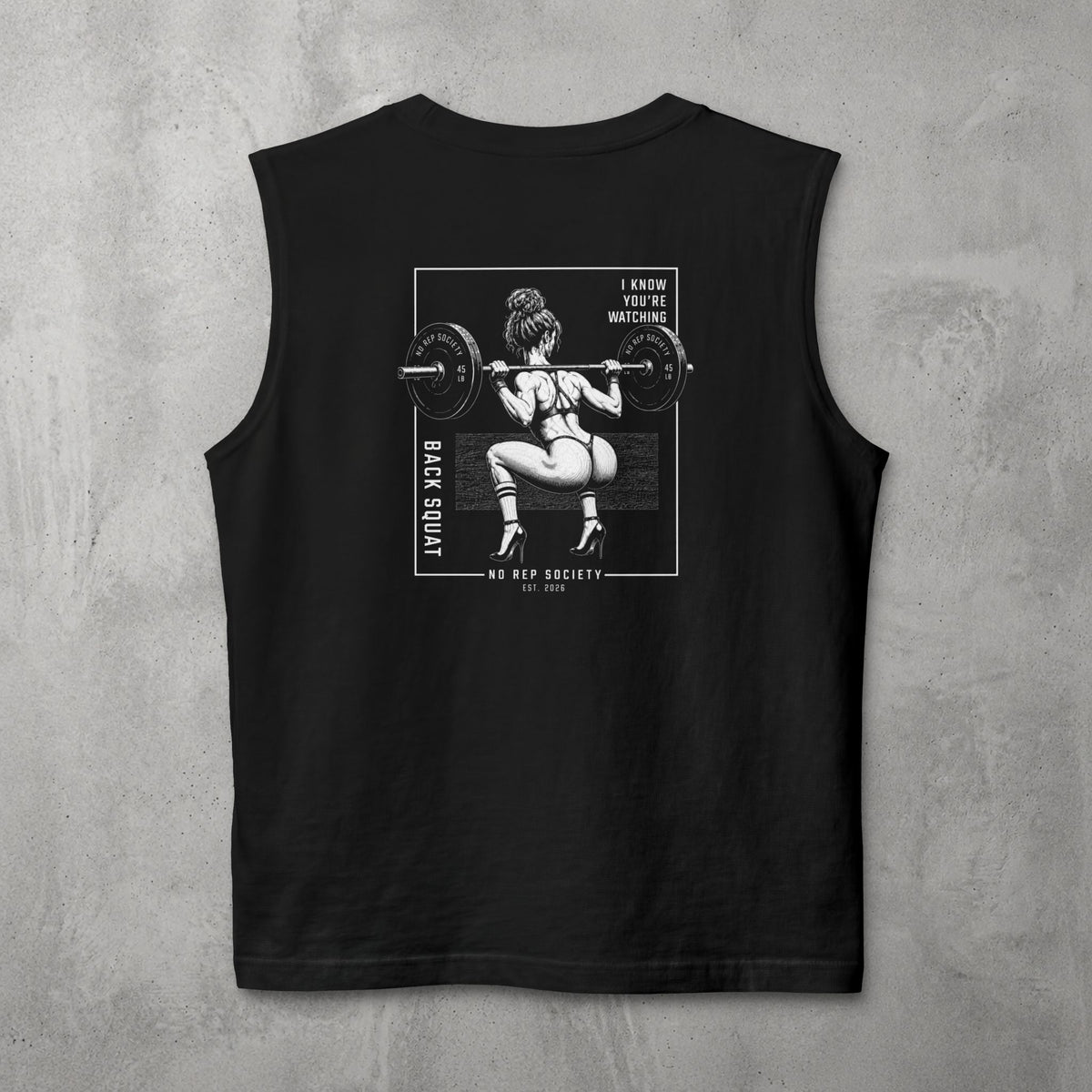 Black I Know You're Watching Muscle Tank by The No Rep Society, flat lay on grey concrete, back print of a woman mid back-squat inside a bordered frame under I KNOW YOU'RE WATCHING lettering.