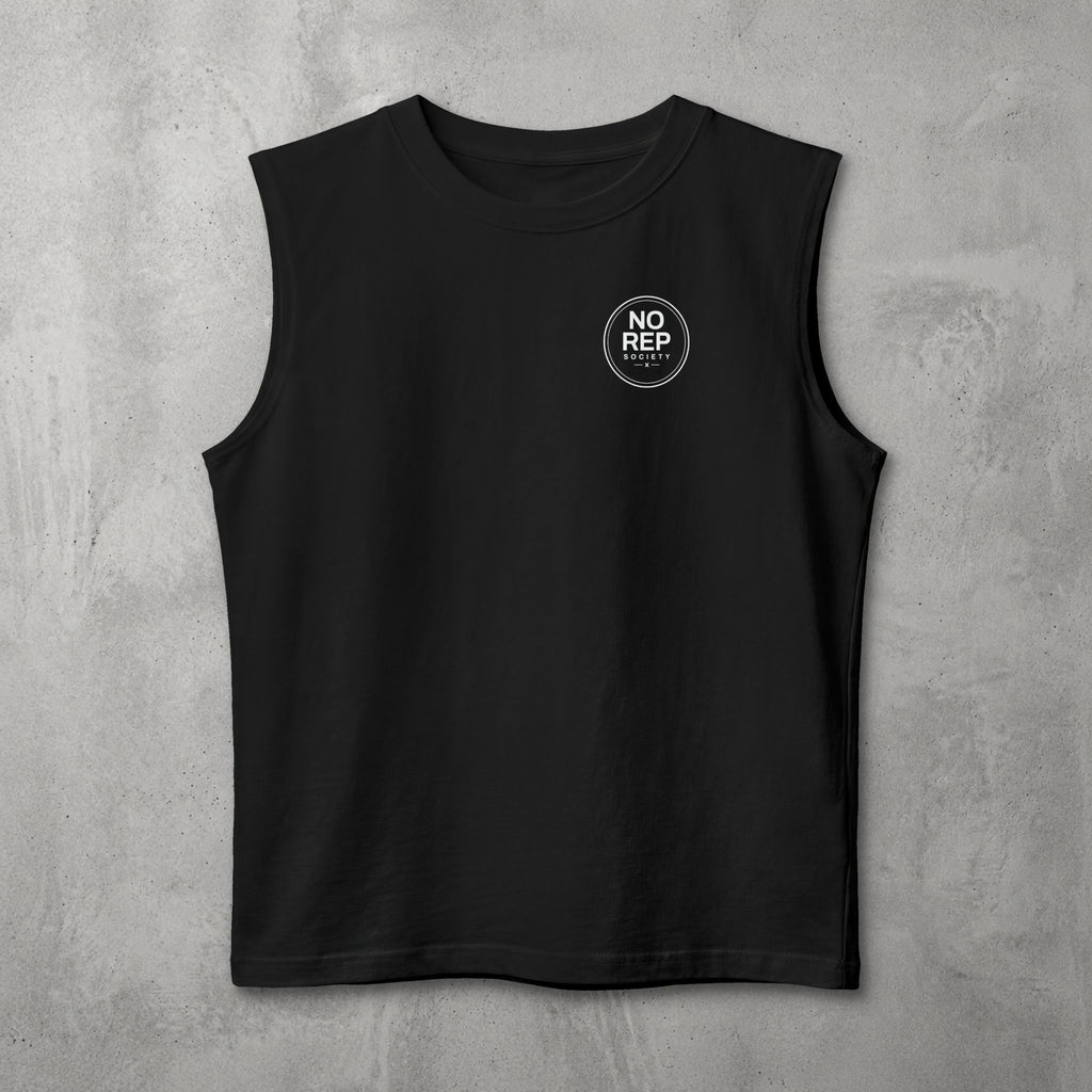 Black NRS Clean Muscle Tank by The No Rep Society, flat lay on grey concrete with a small circular NO REP SOCIETY chest logo and no back print.